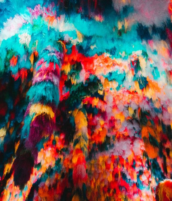 Woman in a dynamic cardio pose against a dark background with violet light streaks.